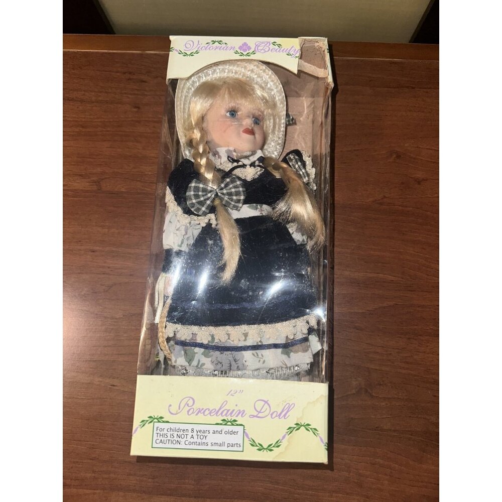Porcelain‎ doll. 12” with layered dress, hat , pantaloons, and removable shoes